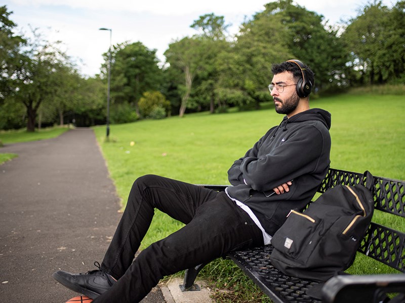 man on a bench in a park